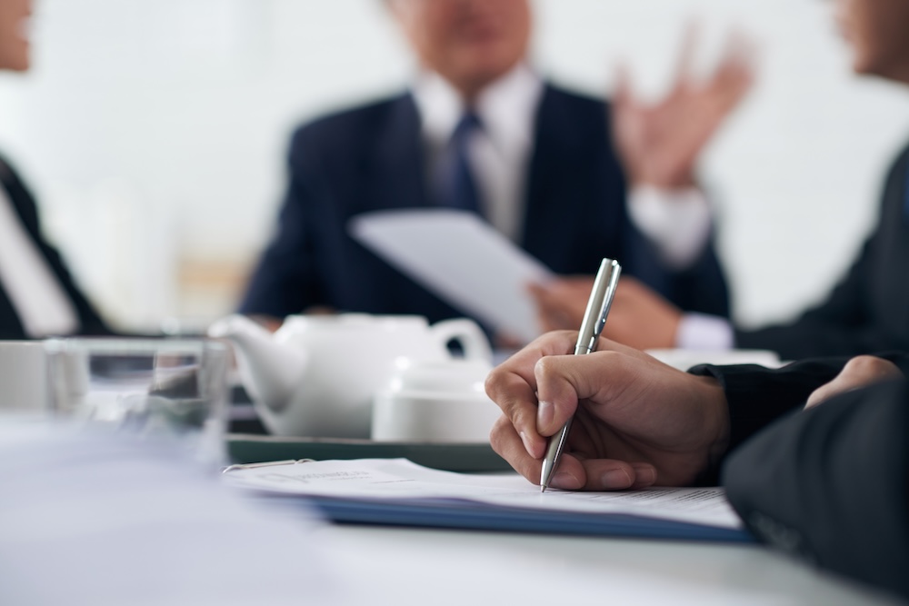 a group of people in a meeting